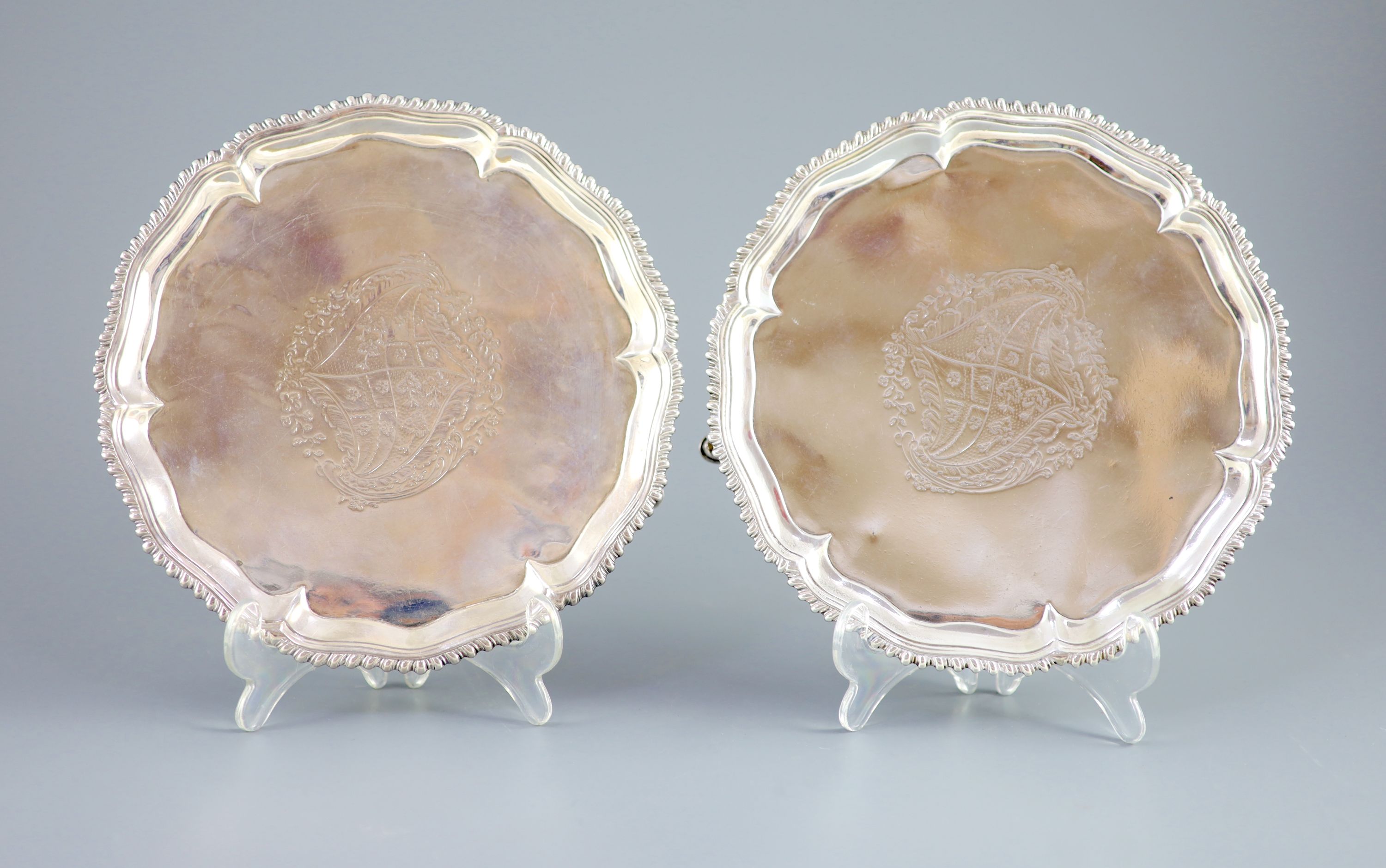 A pair of early George III silver salvers by Richard Rugg,